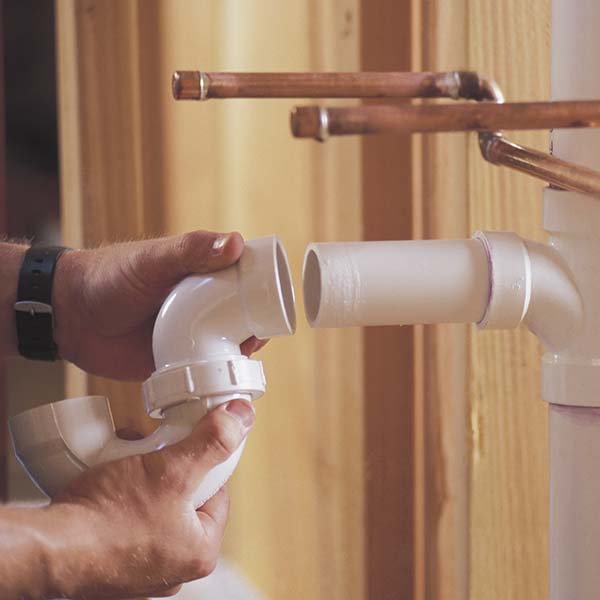 Plumber connecting pipes